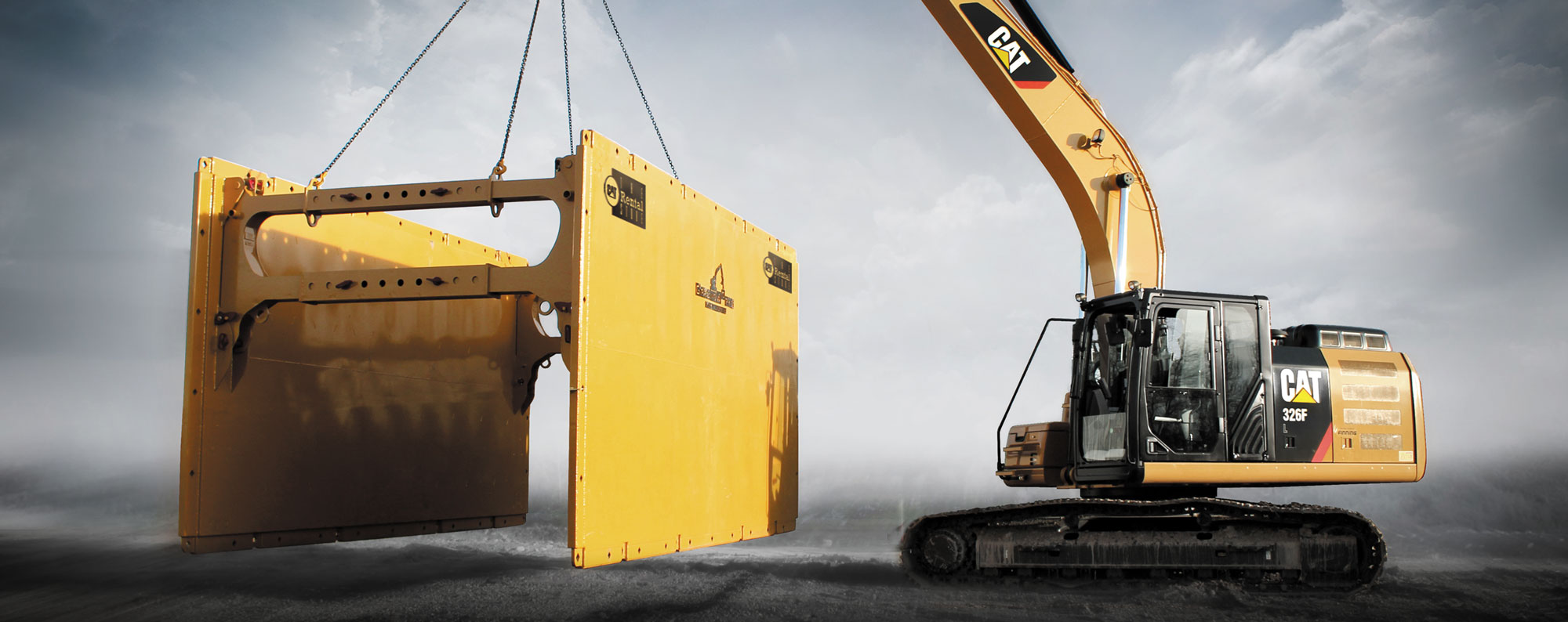 Excavator holding a trench box